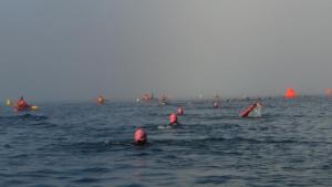 Swimmers stretching out into the fog